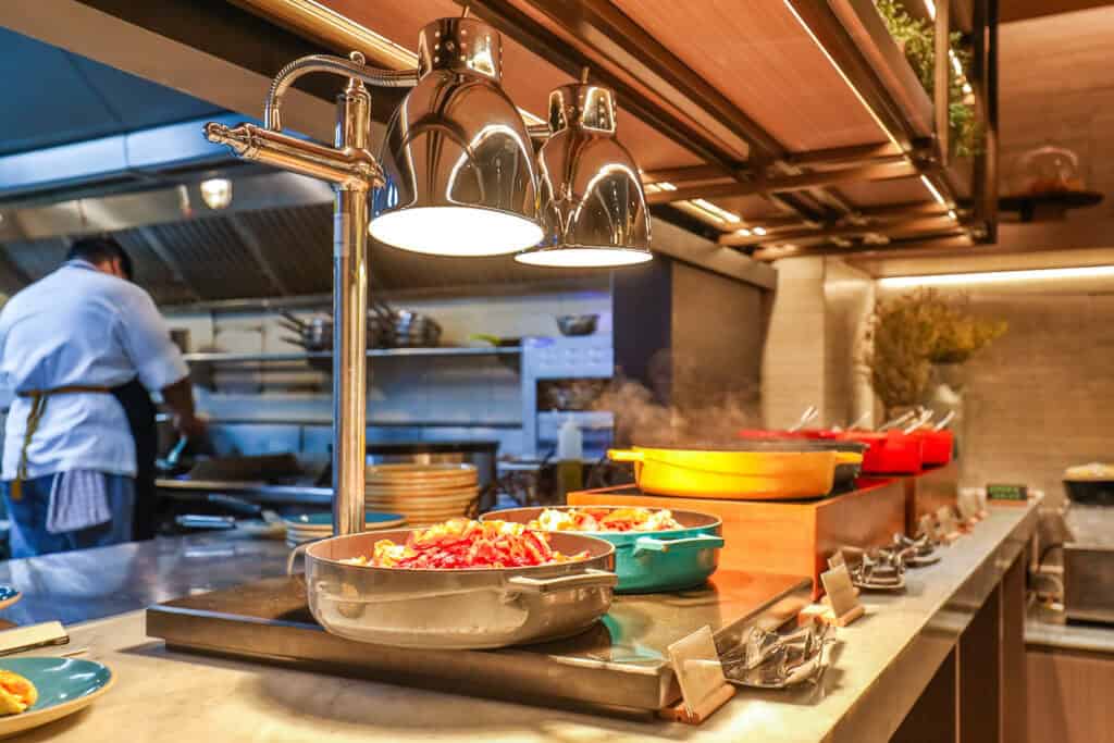 Chef preparing dishes in a professional commercial kitchen